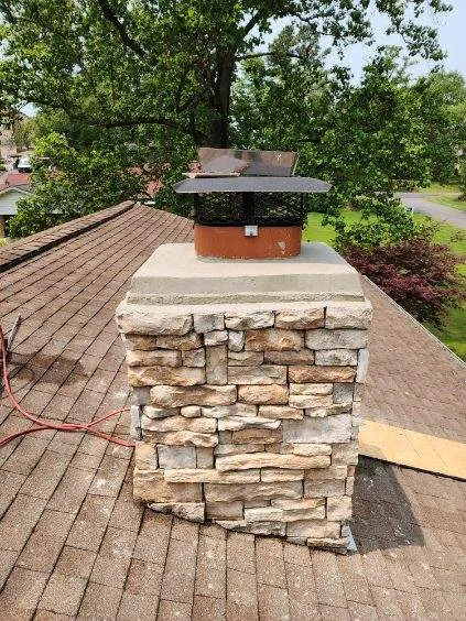 Shingle roofing and stone chimney detail