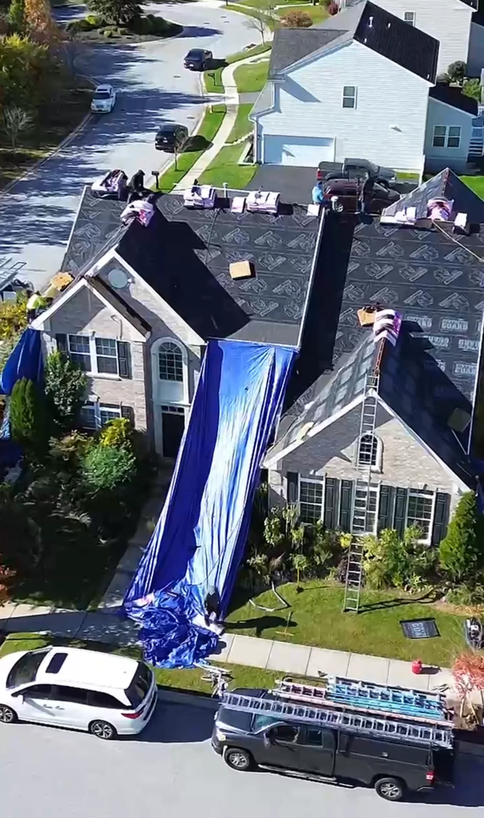 Roof replacement work viewed from above